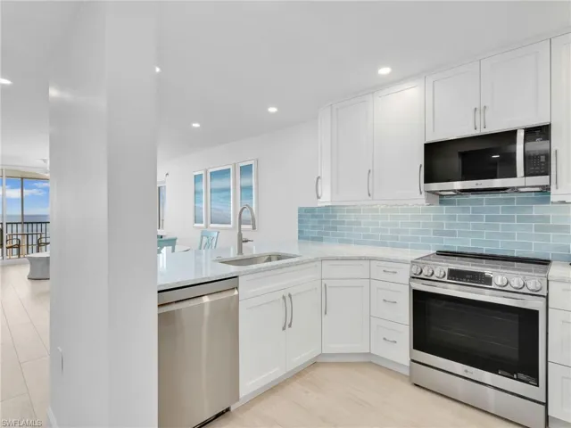 Fully stocked kitchen featuring, Quartz Countertops, brand new cabinetry, brand new appliances, under mount lighting