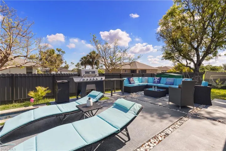 View of patio / terrace with an outdoor hangout area, a fenced backyard, and grilling area