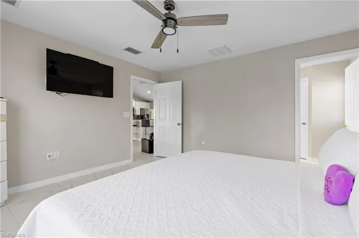 Bedroom with baseboards and ceiling fan