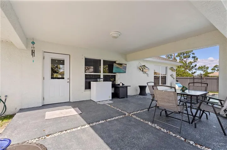 View of patio / terrace featuring outdoor dining area and fence