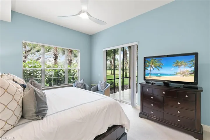 Bedroom featuring carpet flooring, access to exterior, and ceiling fan