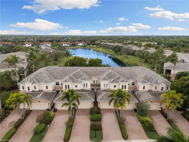 Aerial perspective of suburban area with a large body of water