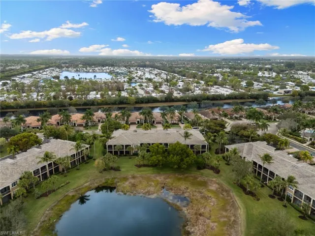 Aerial perspective of suburban area with a large body of water