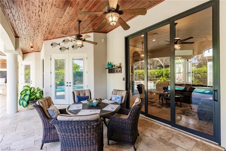 View of terrace featuring french doors and ceiling fan