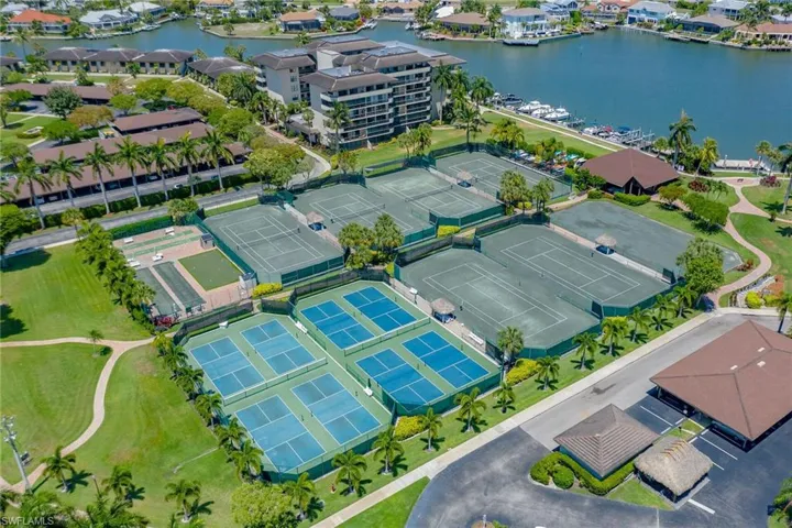 Birds eye view of property featuring a water view and a residential view