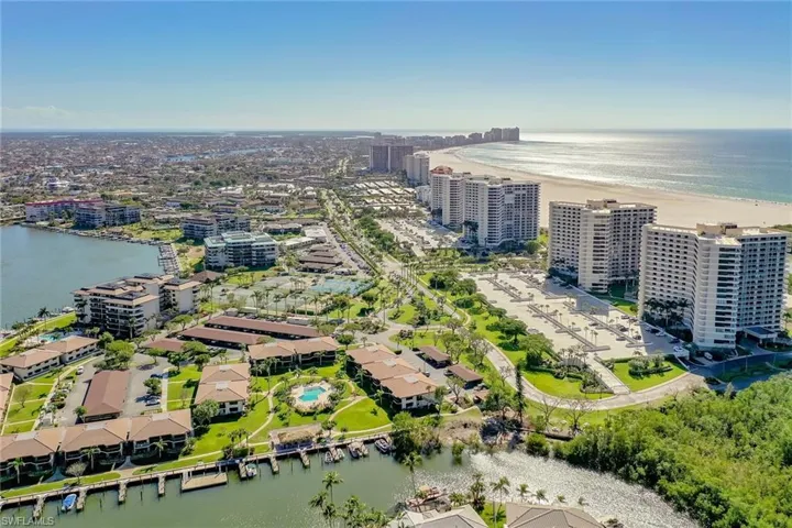 Drone / aerial view featuring a water view and a city view