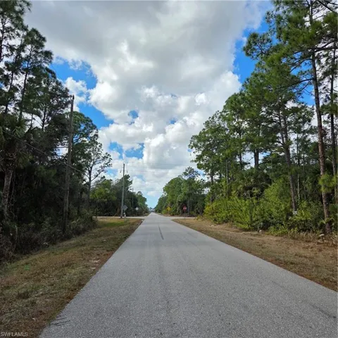 Looking at Everglades Blvd just ahead at the stop sign Turn Rt to heads towards town.