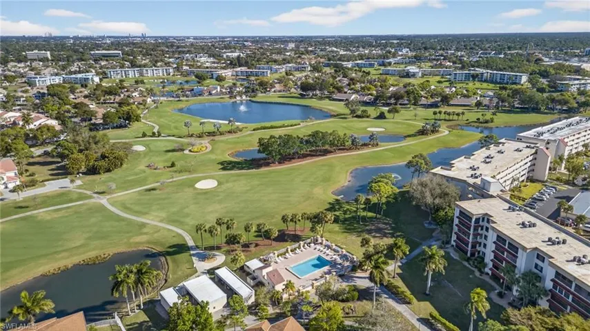 View of property location featuring a large body of water and a golf club