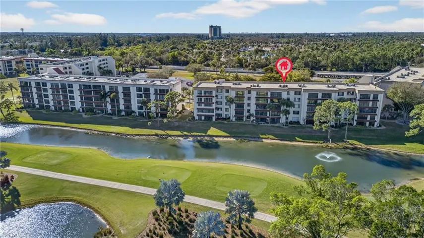 Drone / aerial view of a golf club and a large body of water