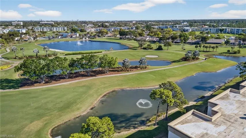 Aerial view of a local golf course and a nearby body of water