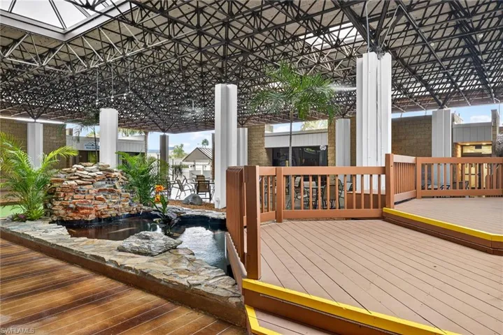 Wooden deck with a garden pond