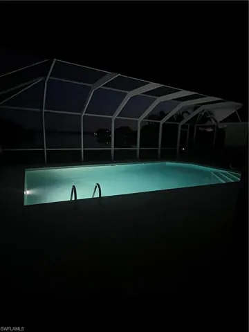 View of pool at twilight