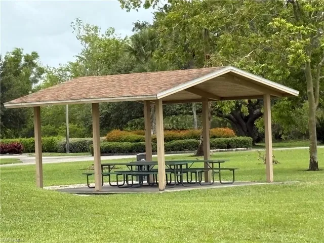 View of home's community with a yard