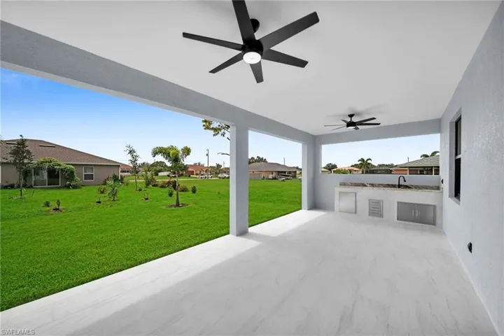 View of patio / terrace featuring area for grilling, ceiling fan, and sink
