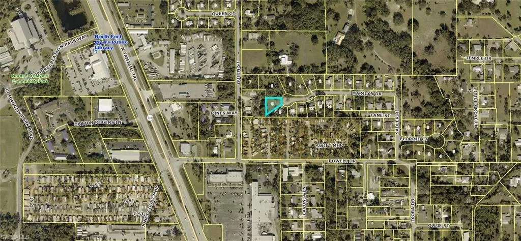 Aerial map of property and surrounding area featuring property parcel outlined