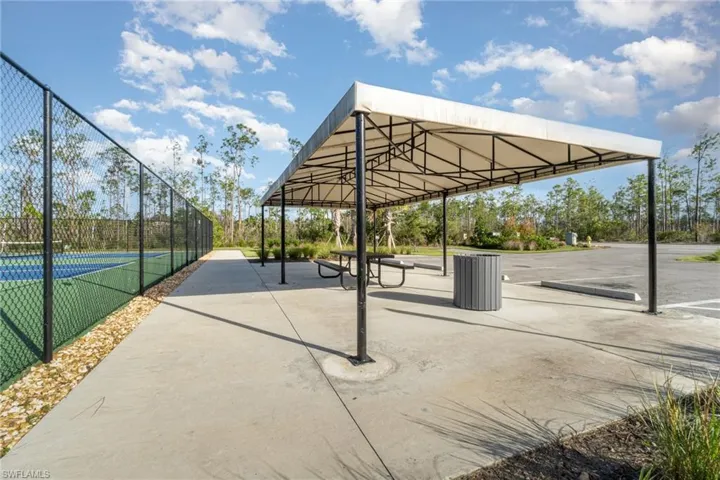 Surrounding community featuring pickleball court