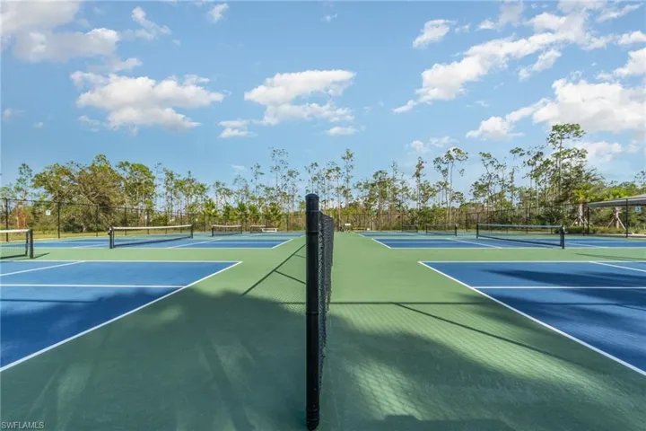 View of Pickleball court featuring basketball hoop
