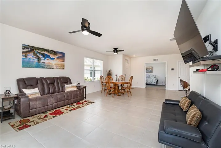 Tiled living room with ceiling fan