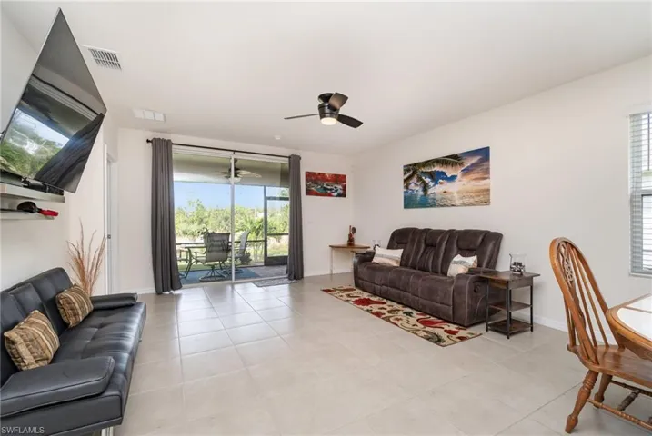 Tiled living room with ceiling fan