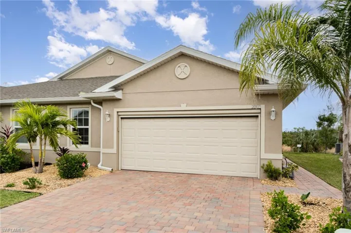 View of front facade featuring a garage