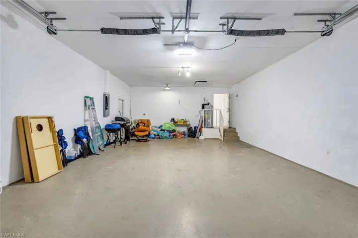 Garage with electric panel and electric water heater