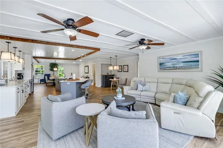 Living room featuring a ceiling fan and light wood-type flooring