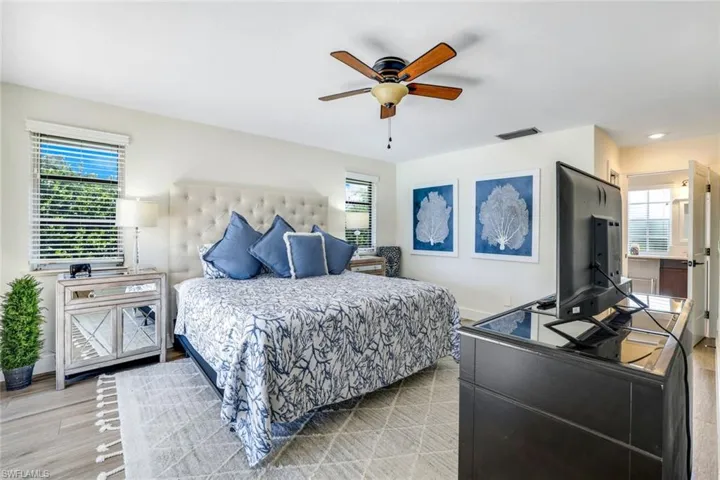 Bedroom featuring light wood-type flooring and ceiling fan
