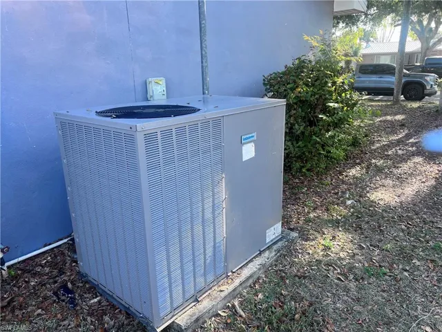 Exterior details with stucco siding and central air condition unit