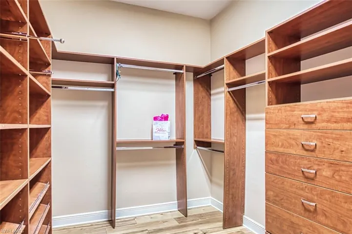 Spacious closet featuring wood finished floors