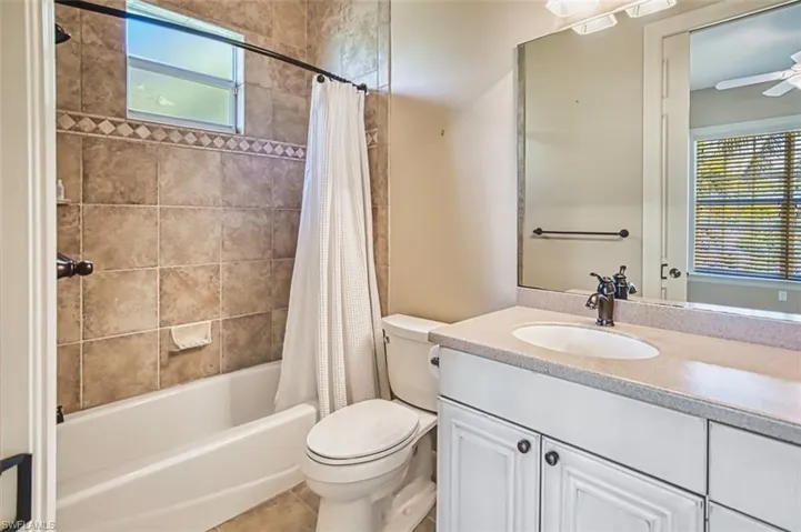 Unfurnished bedroom with light wood-style floors, a closet, and ceiling fan