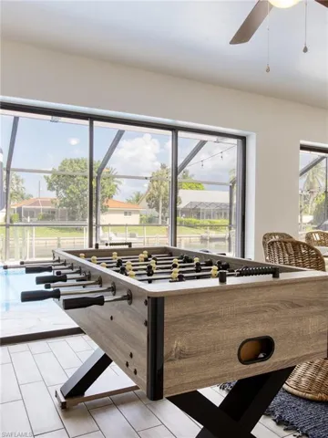 Playroom with plenty of natural light and a ceiling fan