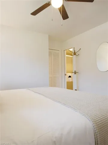 Bedroom featuring a closet and a ceiling fan