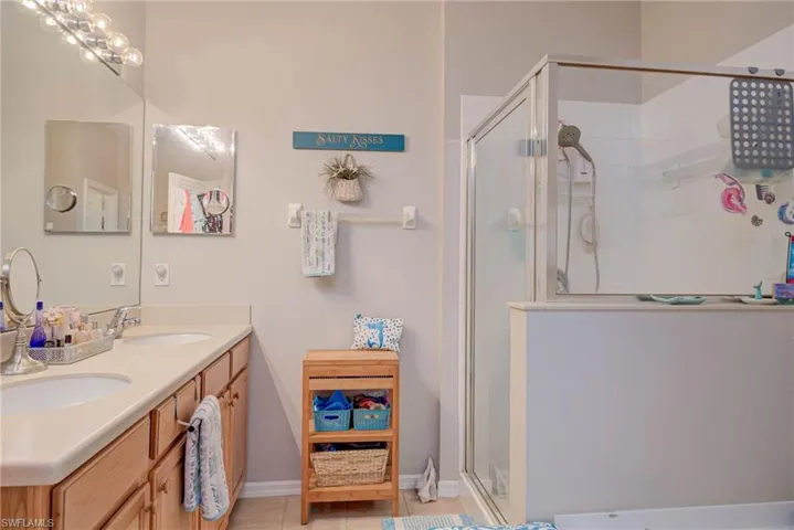 Primary bath offers dual sinks, walk in shower and soaking tub.