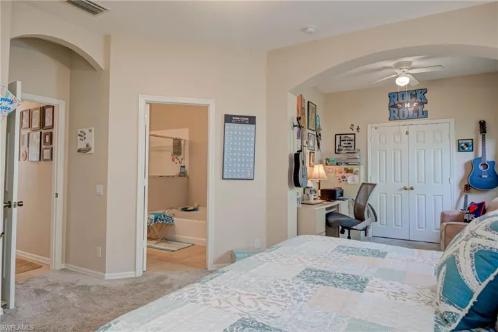 Primary bedroom with sitting area.