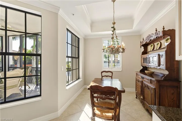 Dining area off kitchen with view of lake
