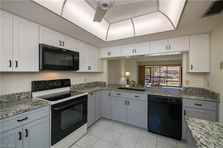 Updated kitchen with granite countertops and soft shut cabinets