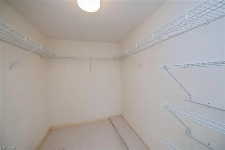 Walk in closet primary bedroom