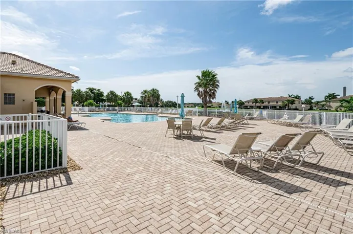 Community pool featuring a patio