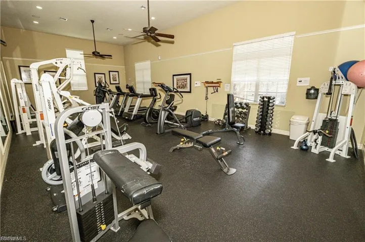 Exercise room featuring a ceiling fan and recessed lighting