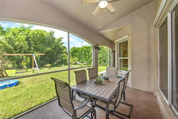 Sunroom featuring ceiling fan and lofted ceiling