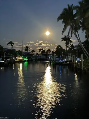 Moon light water view with a boat dock