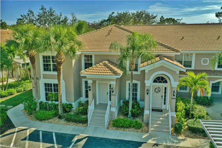 Mediterranean / spanish home with stucco siding and a tile roof
