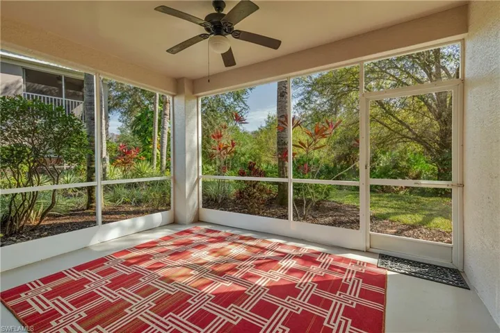 Unfurnished sunroom featuring ceiling fan and healthy amount of natural light