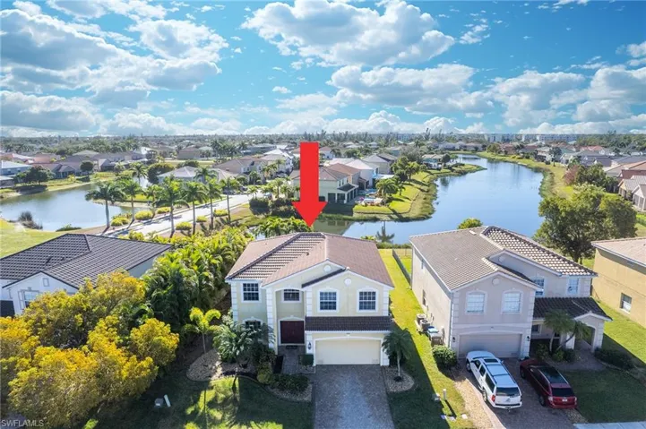 Aerial view of residential area with a large body of water