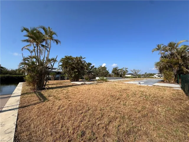 Large lot looking SW.  Concrete pads from previous mobile home.