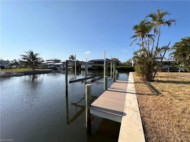 Composite Dock and lift overlooking an intersecting canal.