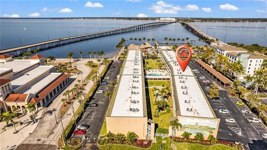 Drone / aerial view of a notable bridge and a large body of water
