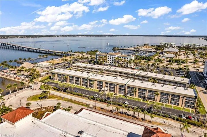 Drone / aerial view of a nearby body of water and a notable bridge