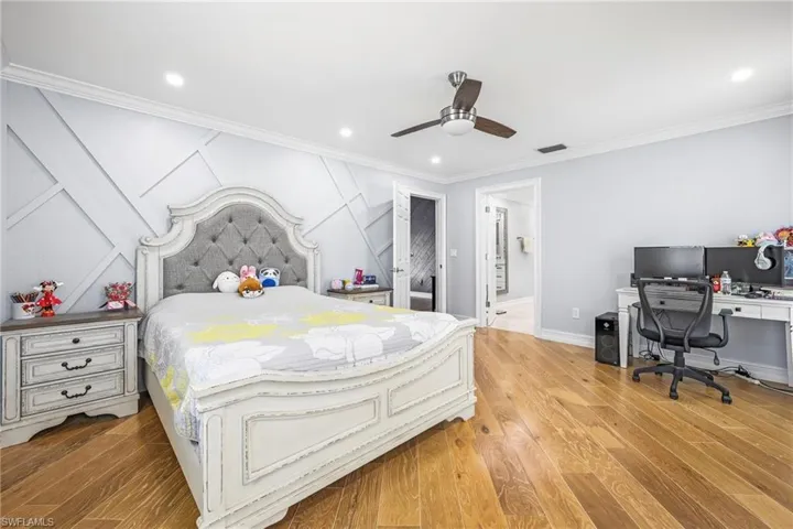 Bedroom featuring wood-finish flooring, recessed lighting, and a ceiling fan