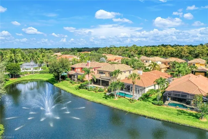 Aerial view of residential area featuring a large body of water